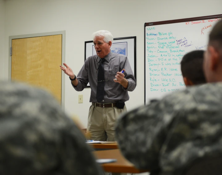 a man in uniform talking to two other men