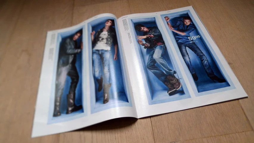 an opened magazine with pictures of two people in it