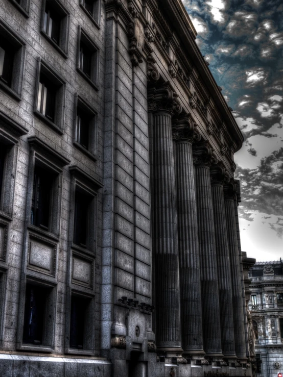 a large tall building near the corner of a street