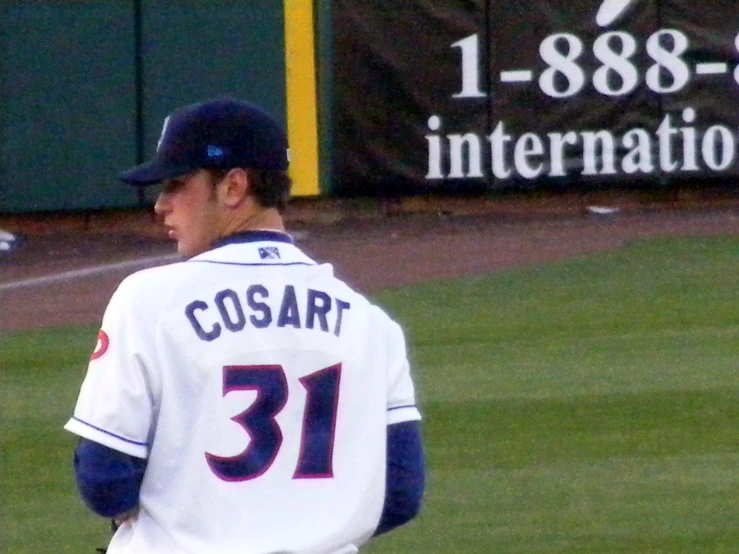 the baseball player is walking on the field