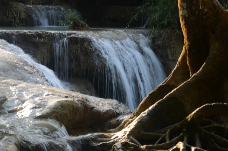 an image of a very pretty waterfall scene