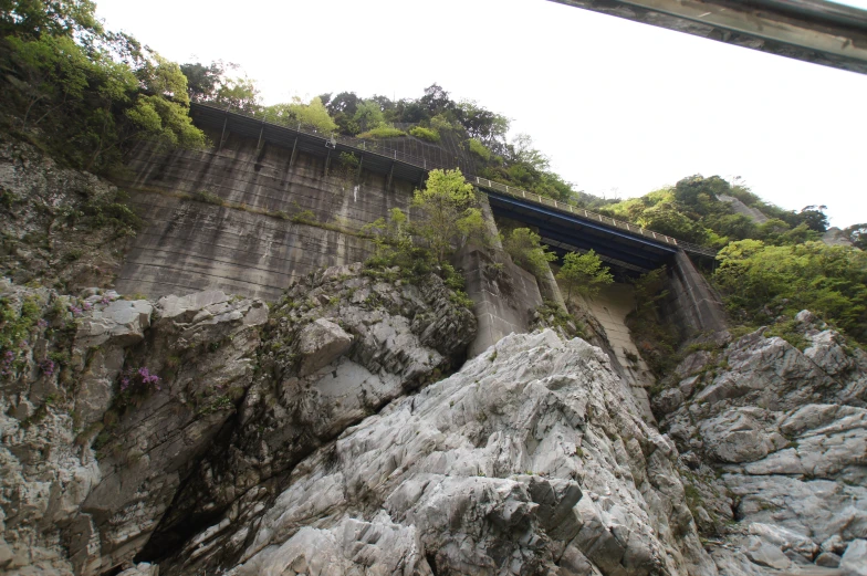 a very large bridge surrounded by some rocks