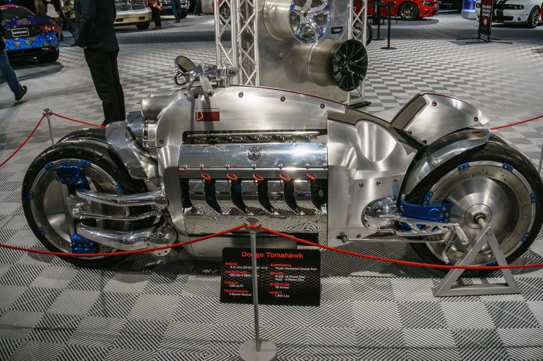 a chrome plate motorcycle is on display at an automotive show