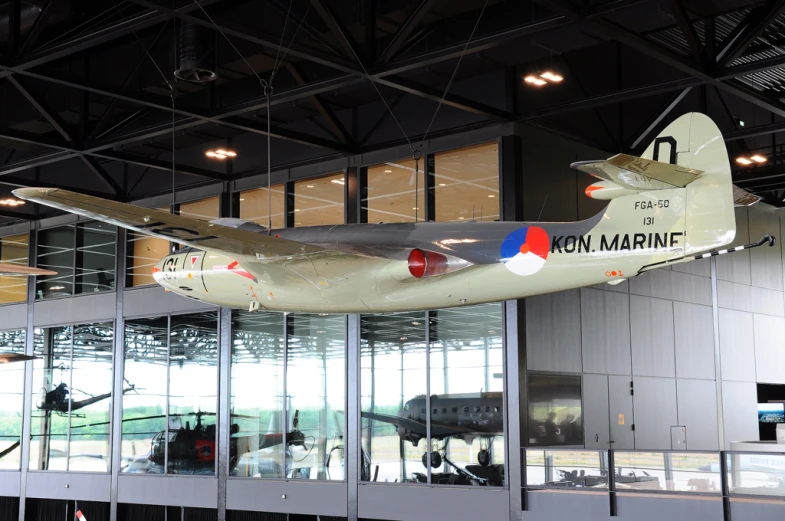 the exhibit of an airplane is inside the building