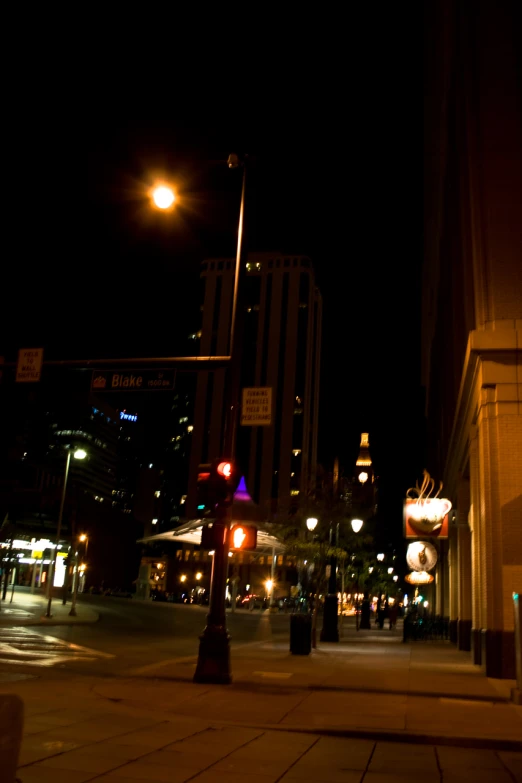 a view of some buildings at night with street lights