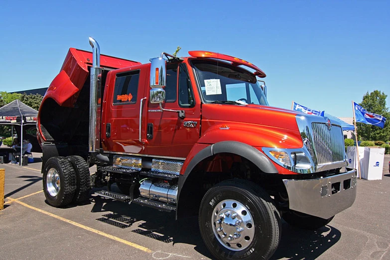 a large dump truck is parked in a parking lot