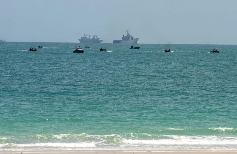 several small boats out on the water