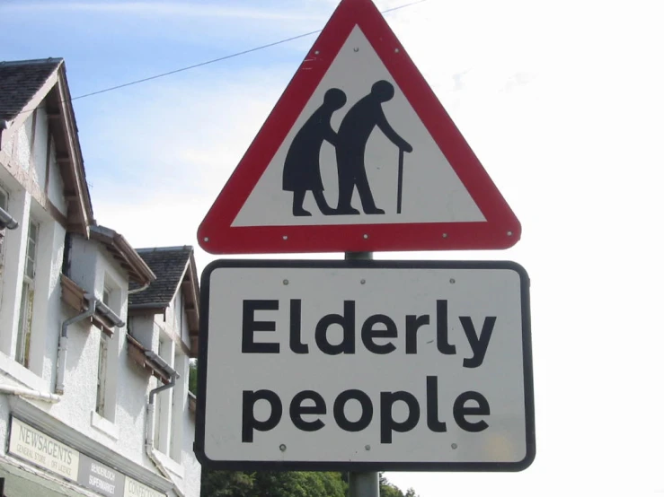 an old man and young lady crossing the street is clearly visible