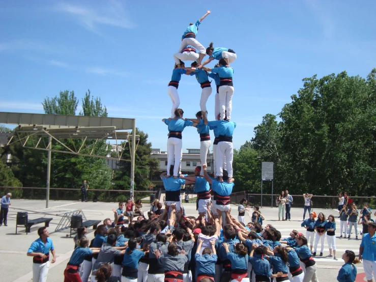 several performers on stilts are performing a show