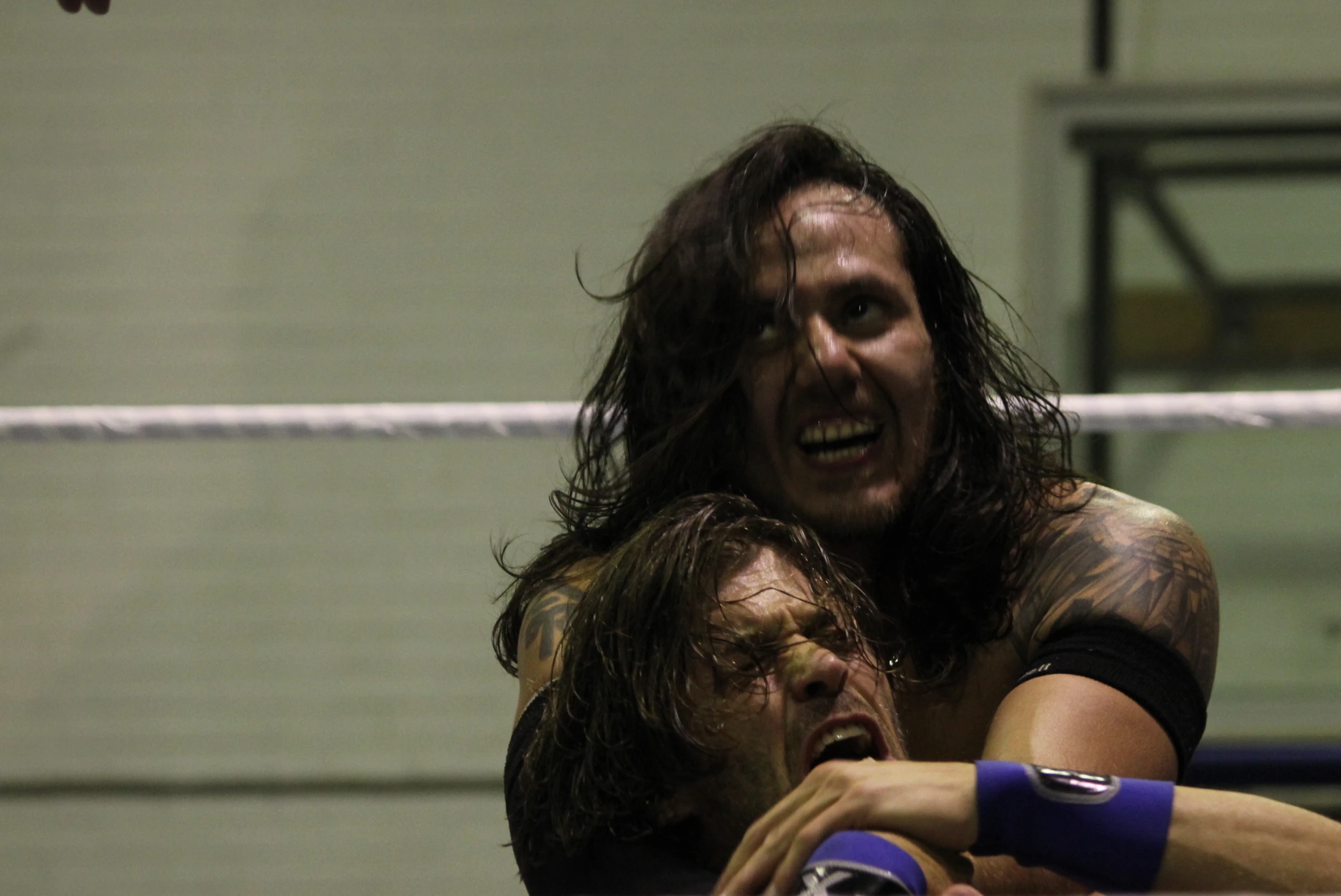 two people emcing each other while standing in a ring