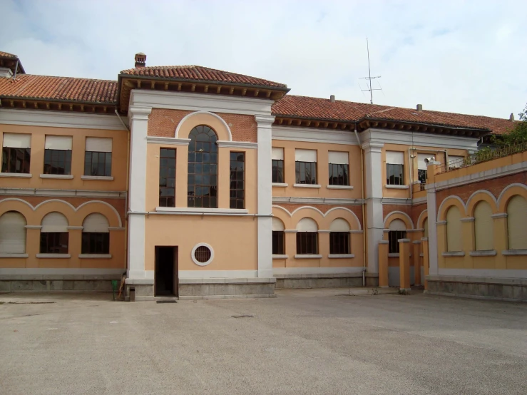 there is a large building with two doors and arched windows