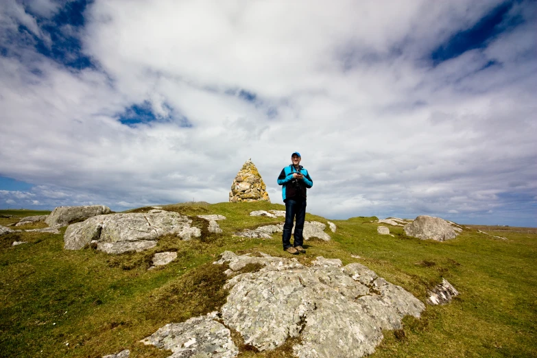 a person standing on the top of a mountain