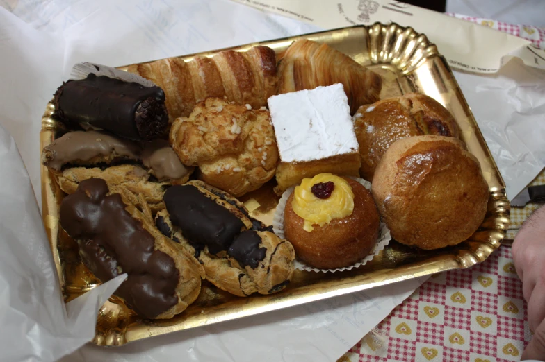 assorted pastries and desserts displayed on a plate