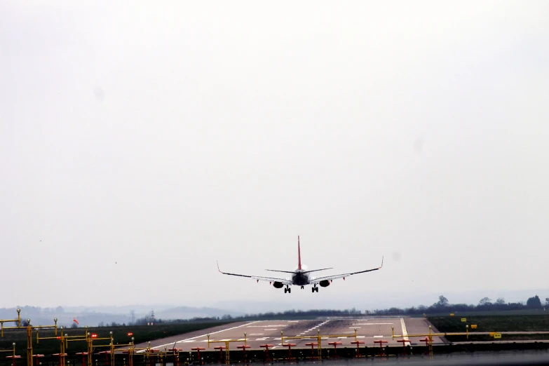 an airplane prepares to land at the airport