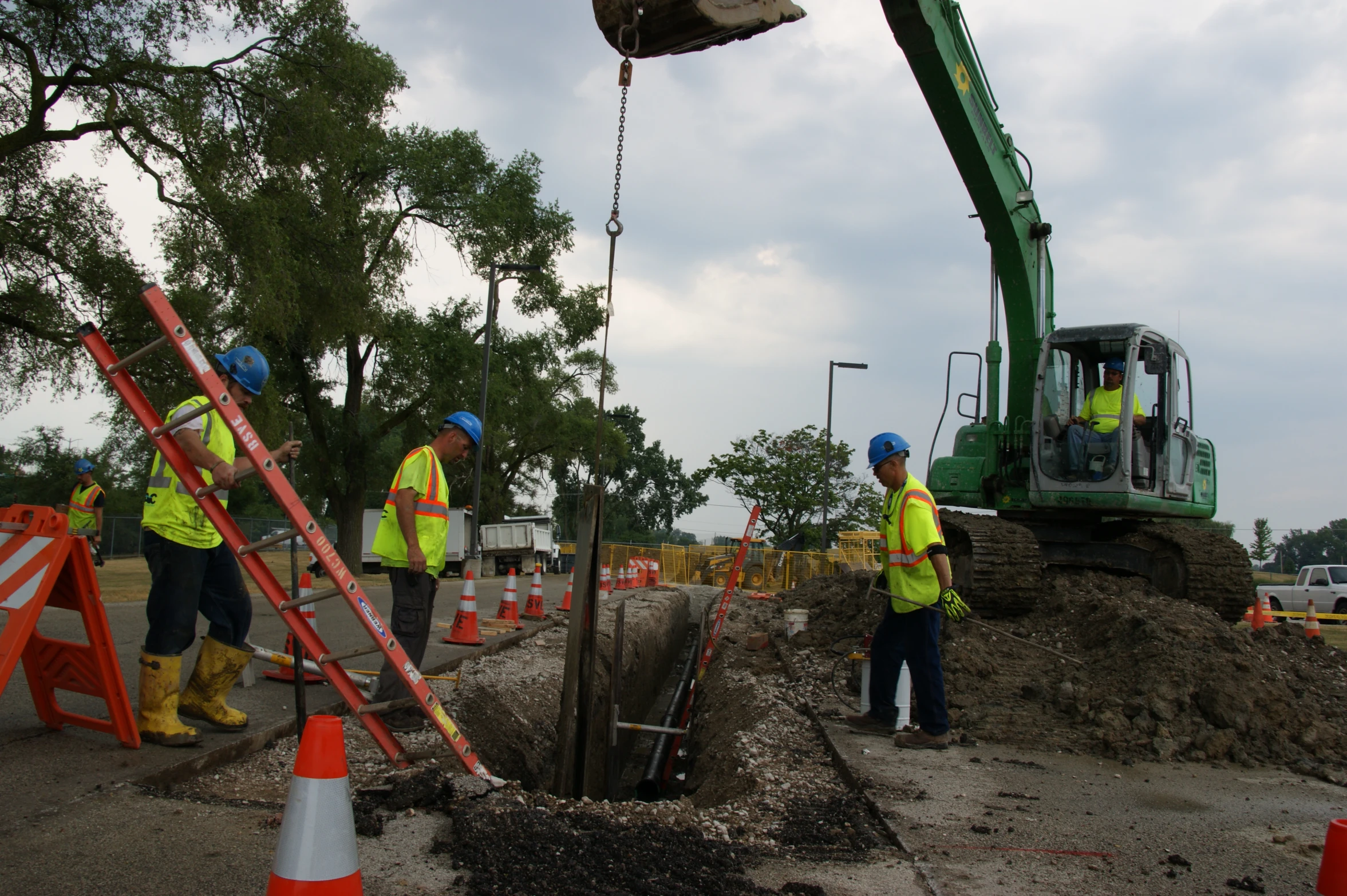 a group of men wearing construction safety vests and reflective vests