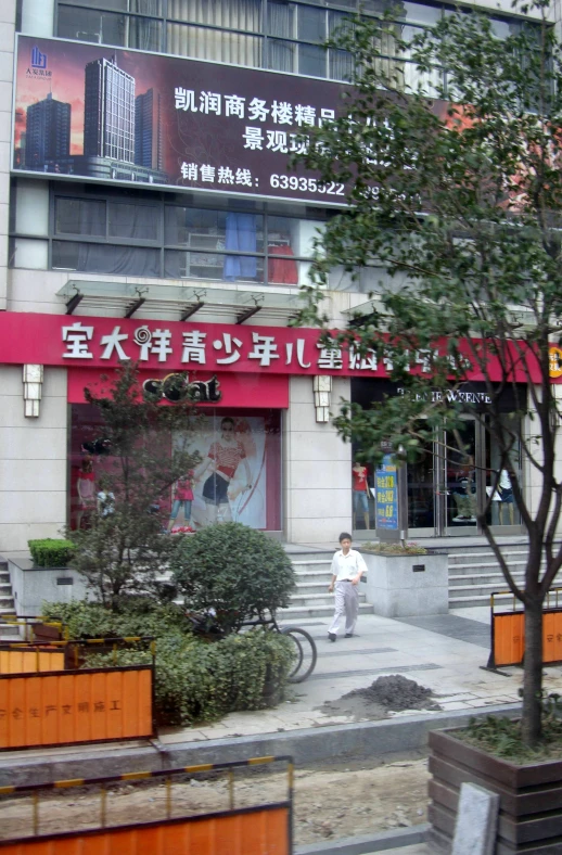 the street is quiet and very narrow as pedestrians walk by