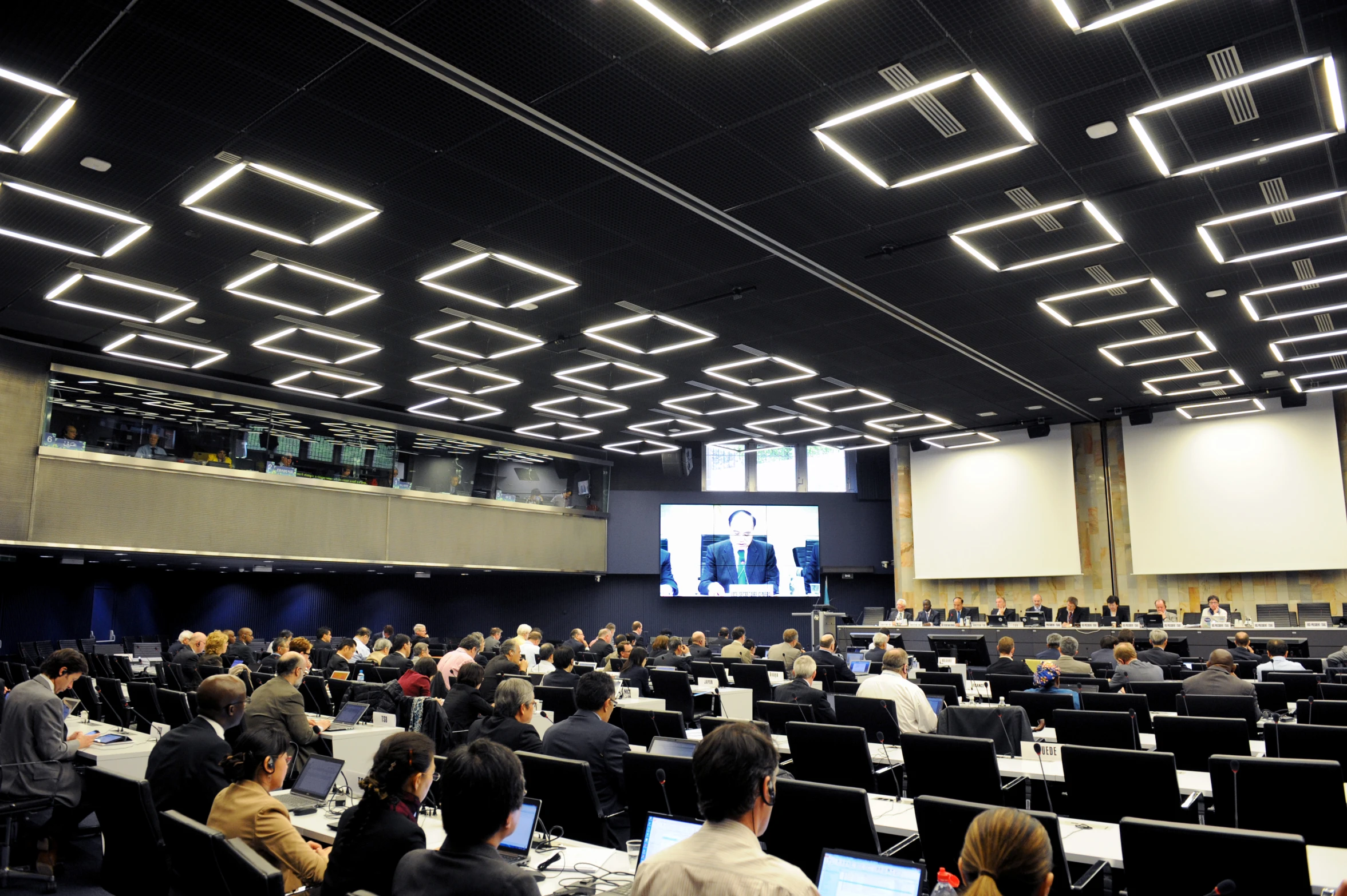 a seminar room full of people at computers