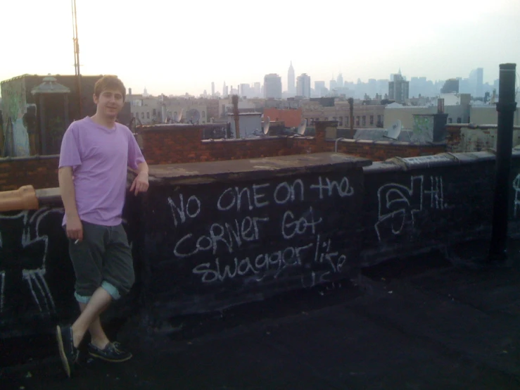 a man is leaning against the wall next to the words no one has control at breakfast