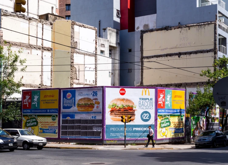 large billboards next to each other on street