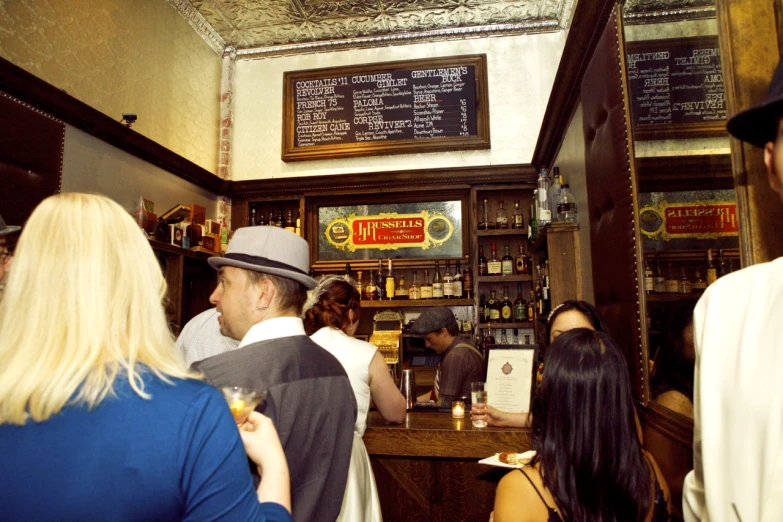 people are gathered in the small restaurant