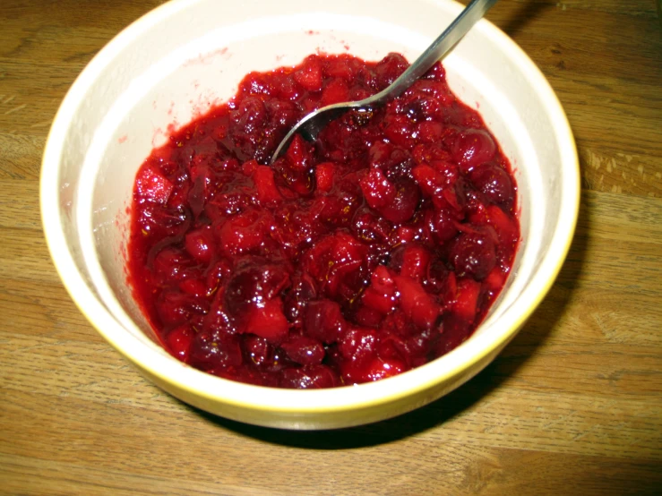 a white bowl with some fruit in it