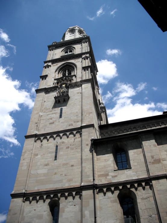 a large stone building with a clock on the side