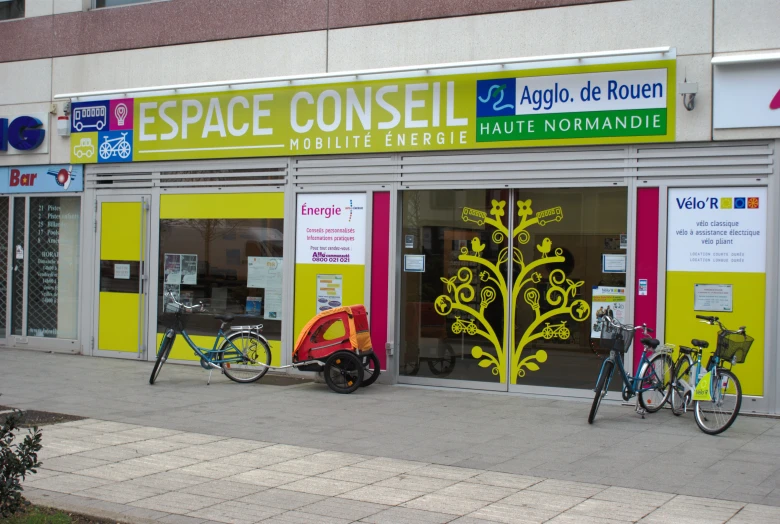 bikes are parked in front of an open store