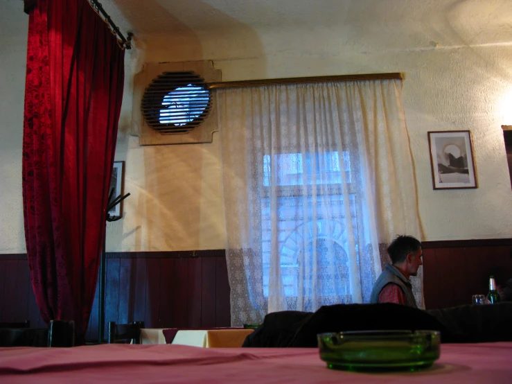 a man sitting at a table with a plate on it