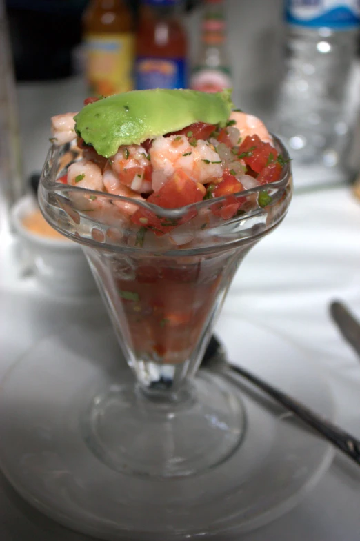 a salad that is on top of a glass cup