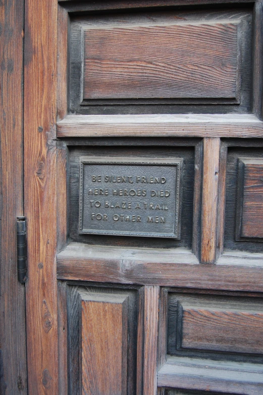 a plaque on the front door of an old house