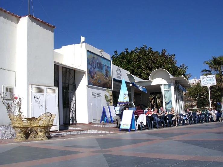 an image of a street scene with a row of shops