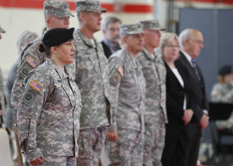 a group of military women standing on top of a field