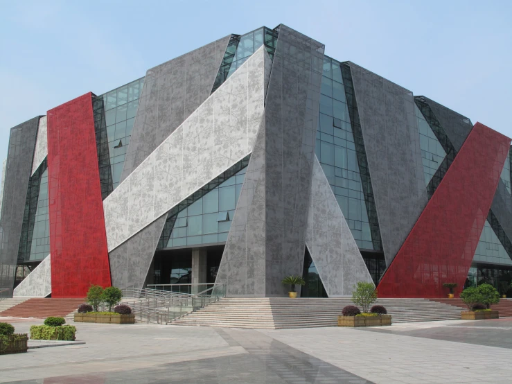 a grey building with red diagonal stripes on it