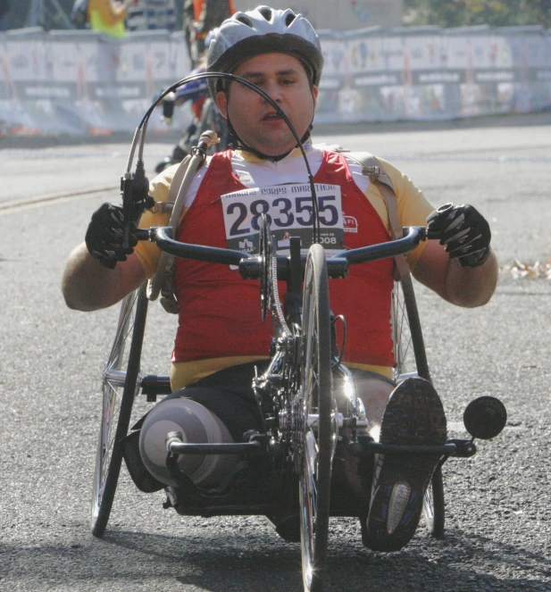 an adult man in a wheelchair is sitting down