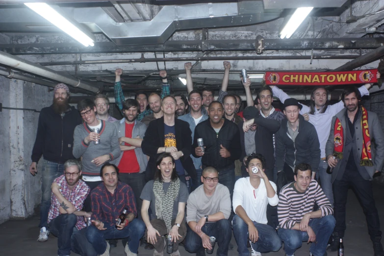 a group of people posing in a large building