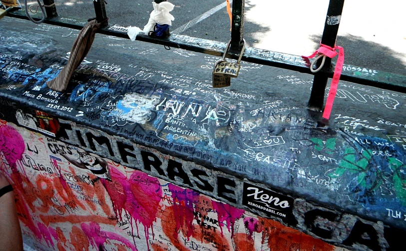 the trunk of an old trunk that has been covered in graffiti