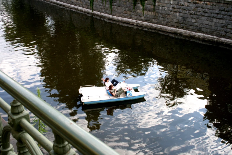 the person is in the boat on the water