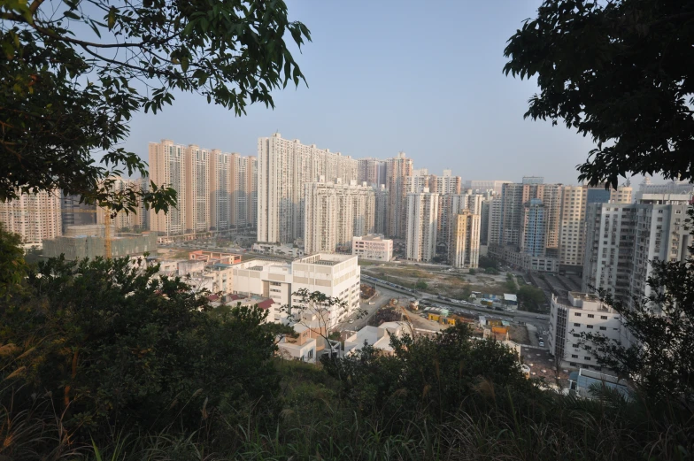a city with high rise apartment buildings sitting in the middle of it