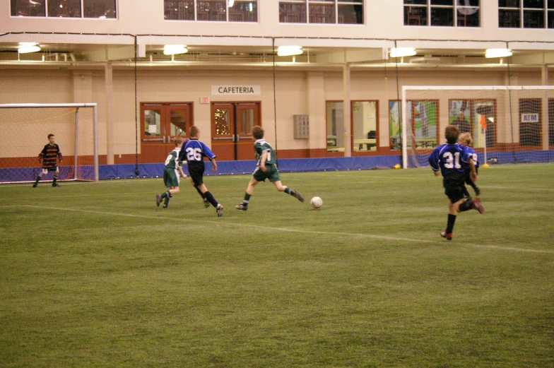 some soccer players are playing on the field