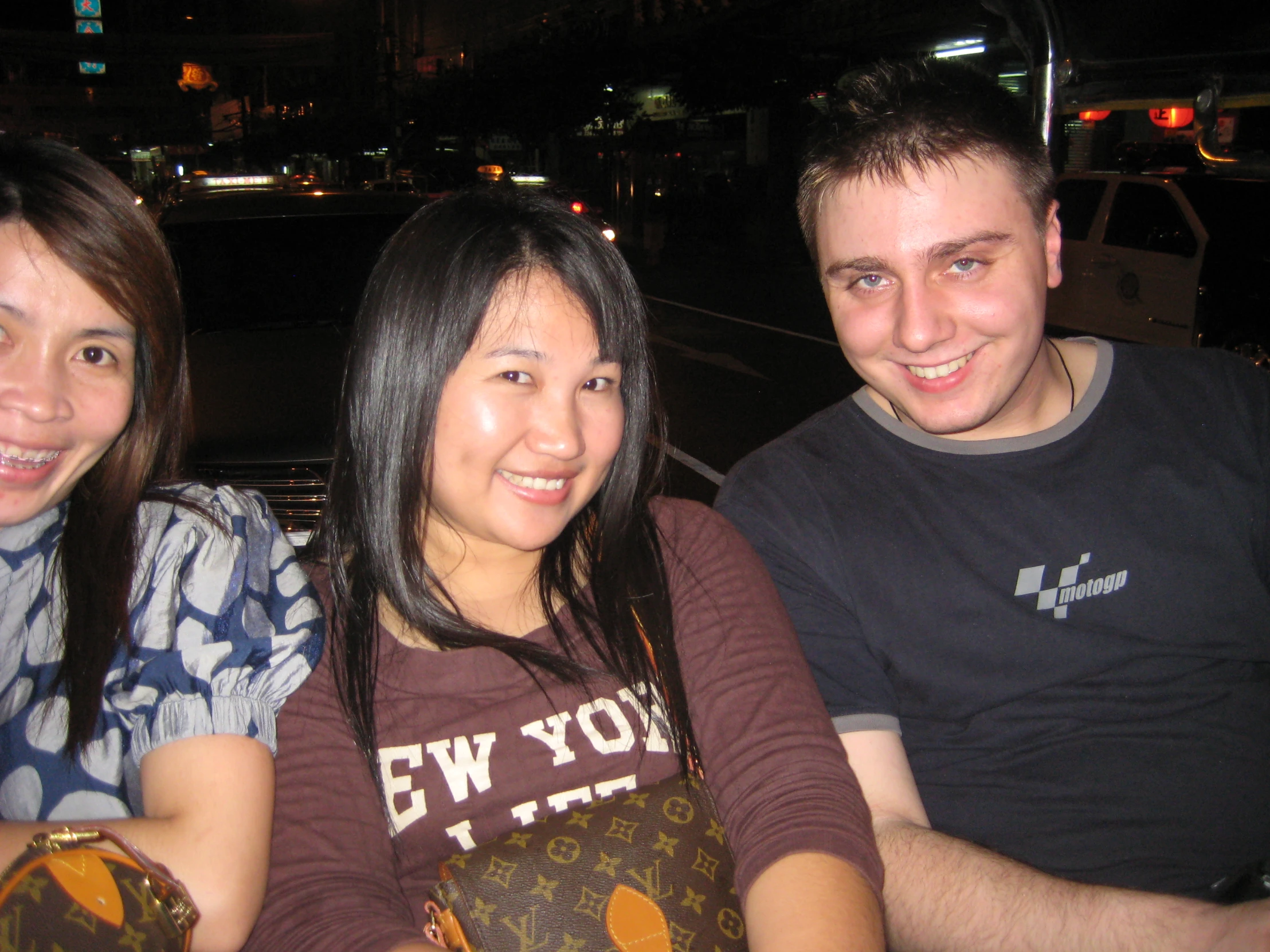 three people are sitting near one another