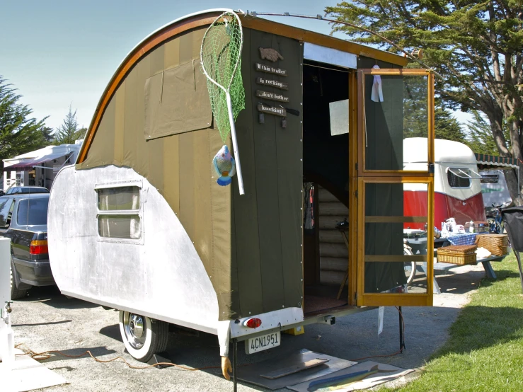 a trailer is parked with a window open