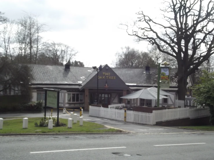 a church and funeral shop in an older, grassy area