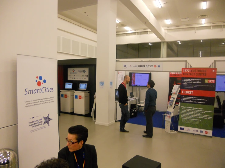 people are viewing information at an exhibit