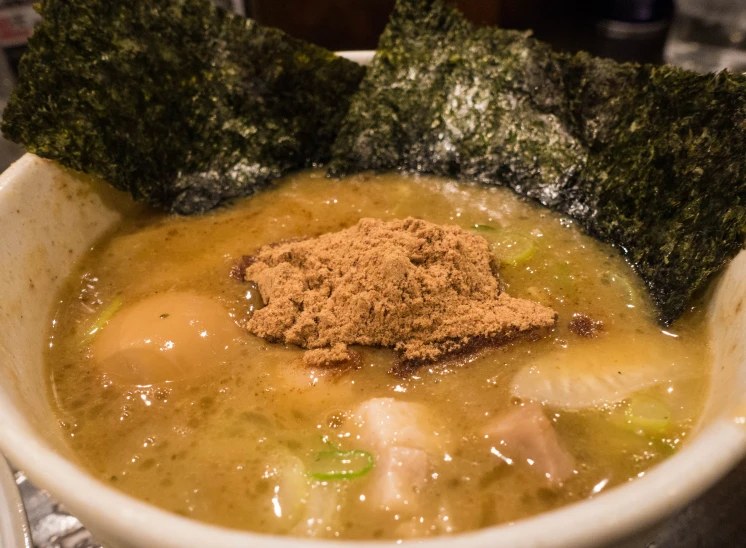 a big bowl filled with some food on top of it