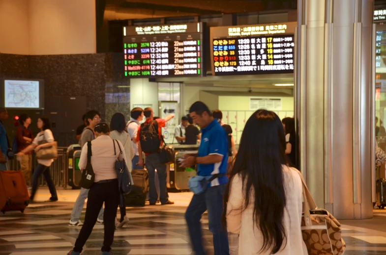 a group of people standing in a lobby area