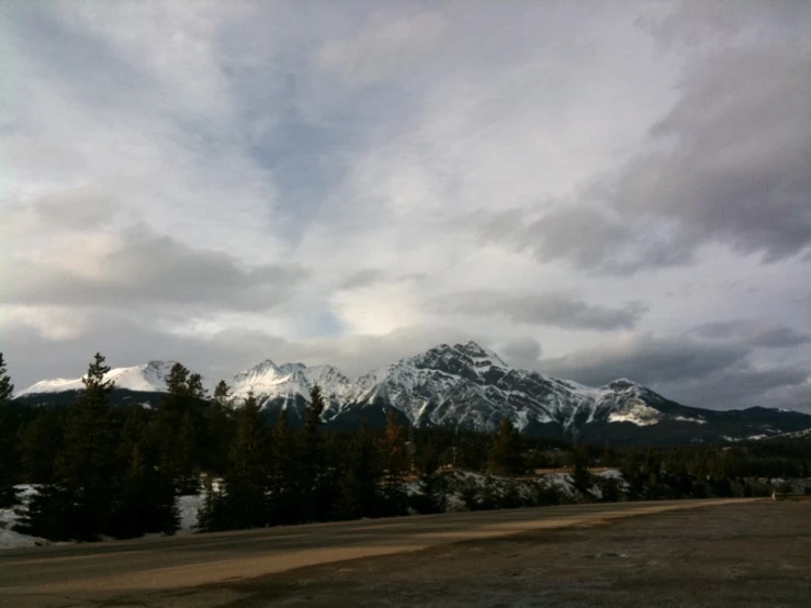 a beautiful landscape shows a mountain covered in snow