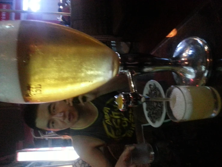 a man sitting at a bar with food and drinks