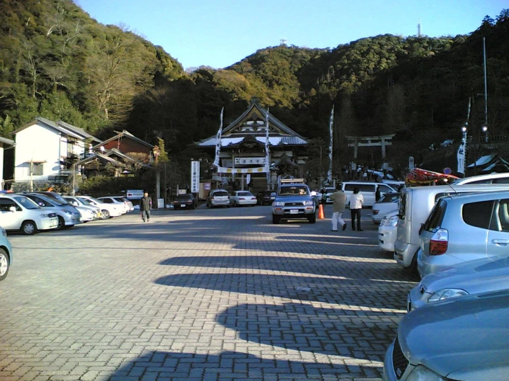 a bunch of cars parked on the side of a road