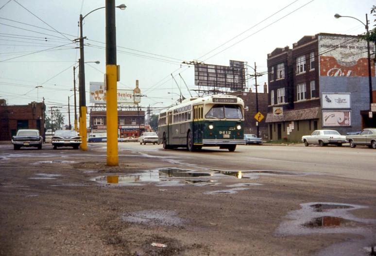 an old double decker bus traveling down the road