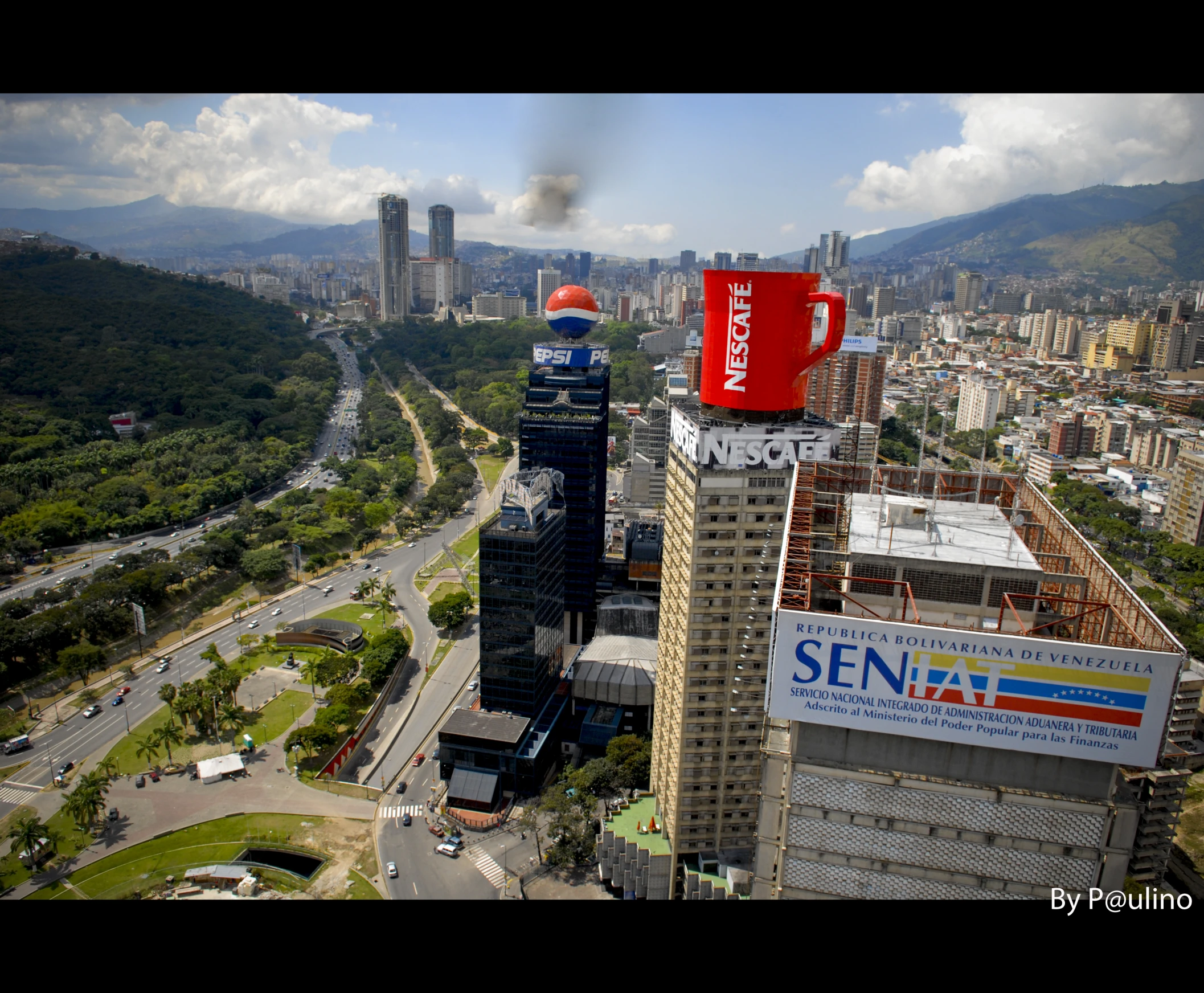 the aerial view of the city shows tall buildings, roads and large billboards